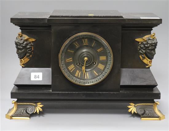 A Victorian black slate mantel clock with bronze masks length 41cm